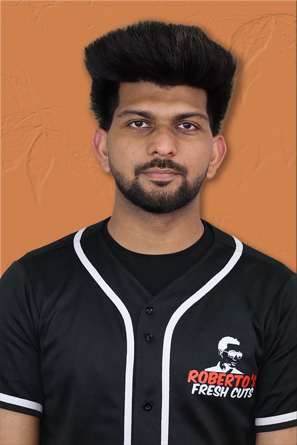 A barber on the Roberto's Fresh Cuts team