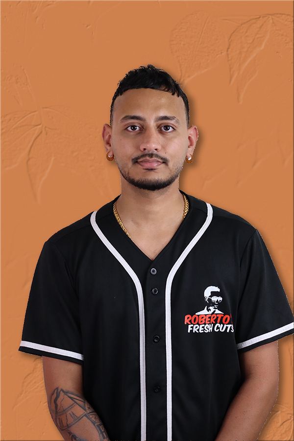 A barber on the Roberto's Fresh Cuts team