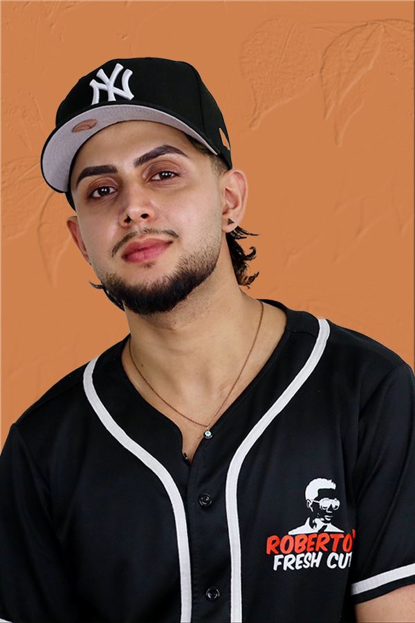 A barber on the Roberto's Fresh Cuts team